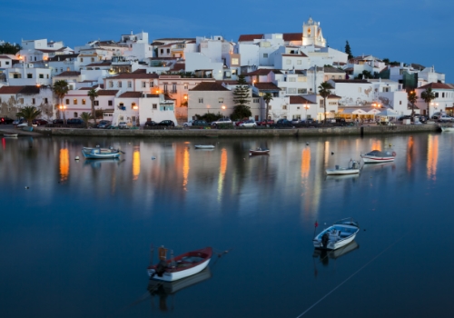 water view of illuminated cityscape of ferragudo