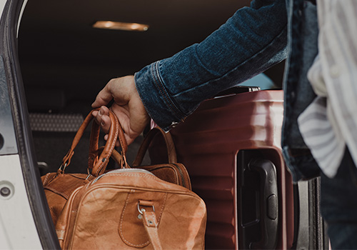 man packing in his luggage suitcase