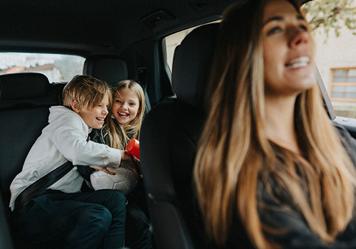 children playing inside the car