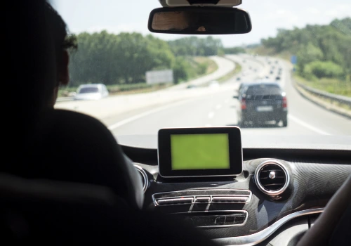 Interior view of a car driving on a highway during daytime.