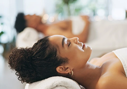 Couple relaxing in a spa on a rainy day
