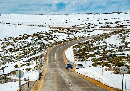 Mountain road in Serra da Estrela covered in snow.