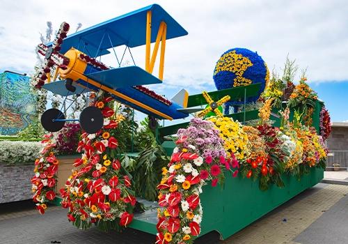 Flower-decorated parade float during the Madeira Flower Festival procession.
