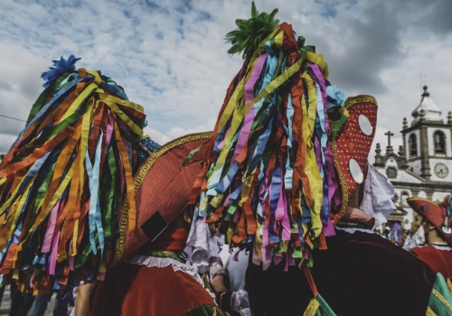  colorful hats with church in background