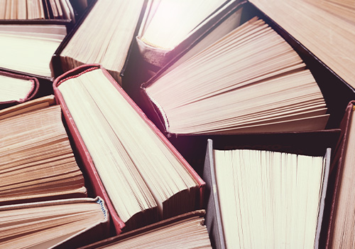 hard books on wooden table