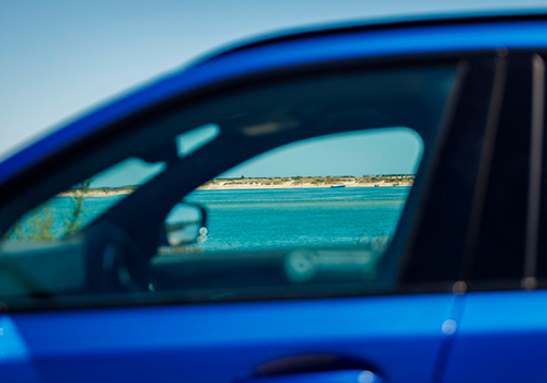 View of a must-visit location in Portugal, seen from the window of a blue car.