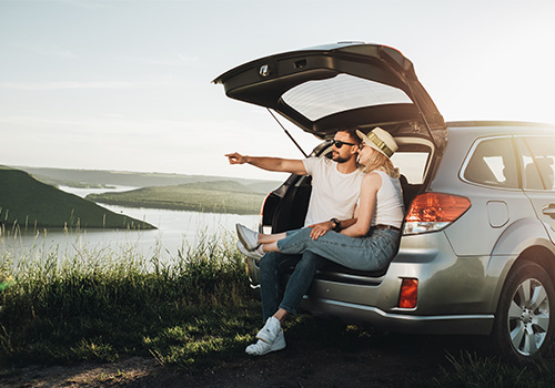 couple relaxing inside car