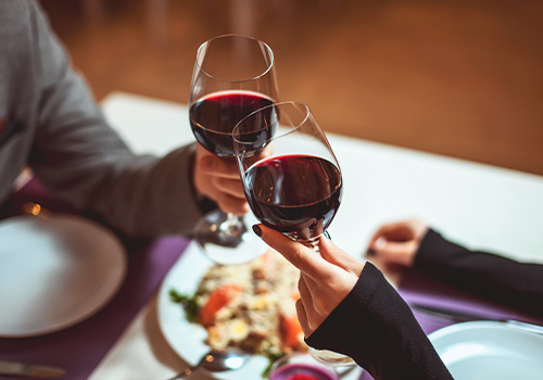 young couple raising glasses