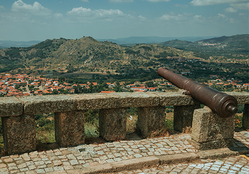 Old Cannon Overlooking Hilly Landscape in Monsanto