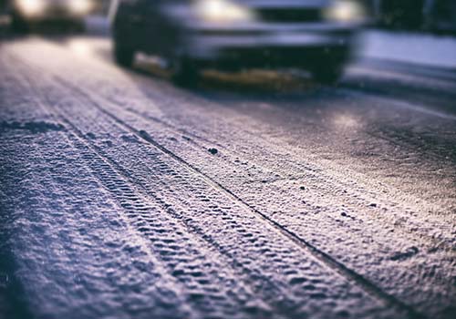 cars driving on a snowy road