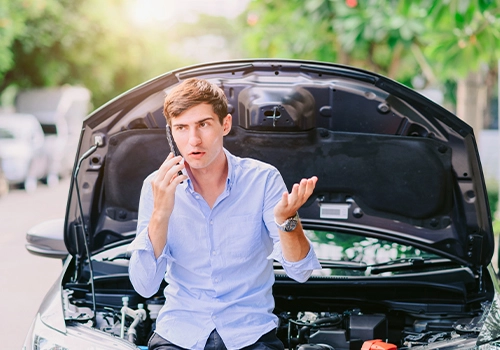 Driver contacting rental car insurance assistance