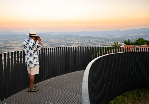 Tourist photographing the sunset in Serra da Estrela. 