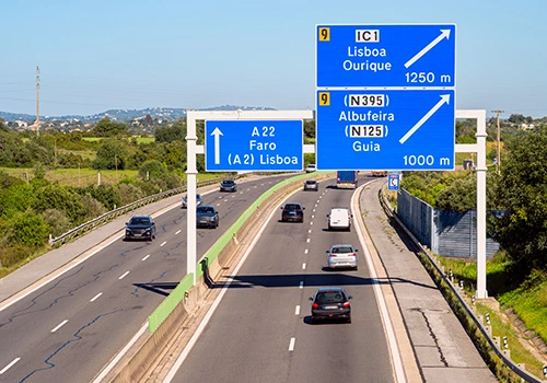 Directional Signs on A22 Highway to destinations in Algarve, Portugal and Portuguese Capital, Lisbon (Lisboa)